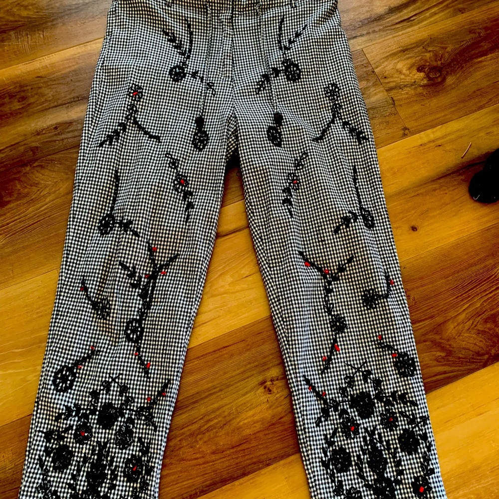CAPRI BLACK AND WHITE CHECK WITH SOME RED BEADING. SIZE SMALL